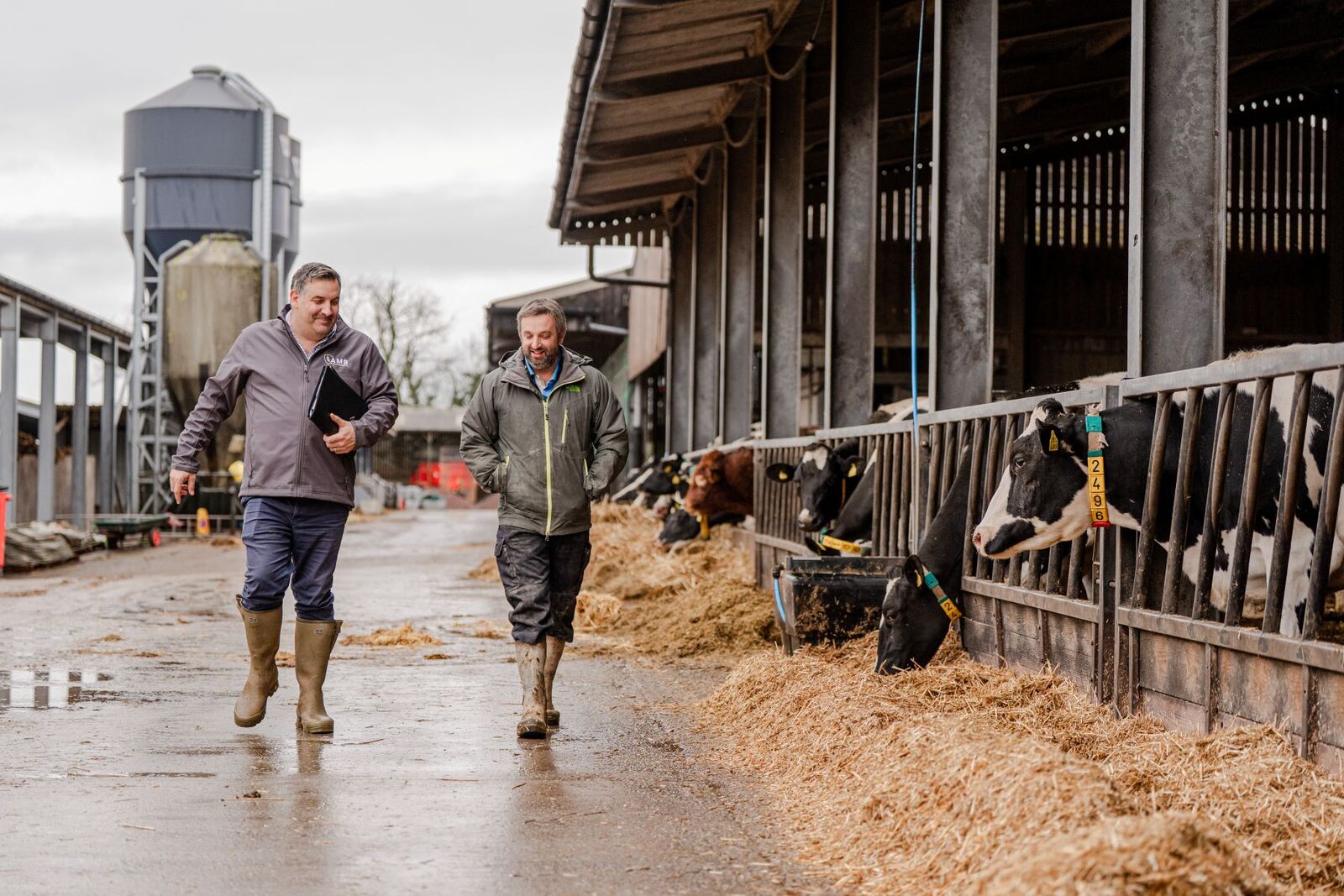 Insurance advisor meeting a farmer on site, highlighting friendly local support and advice.