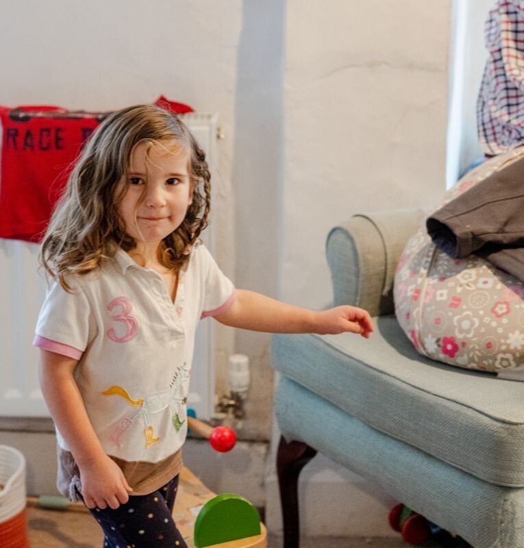 Child playing at home, representing families and everyday life protected by personal insurance cover