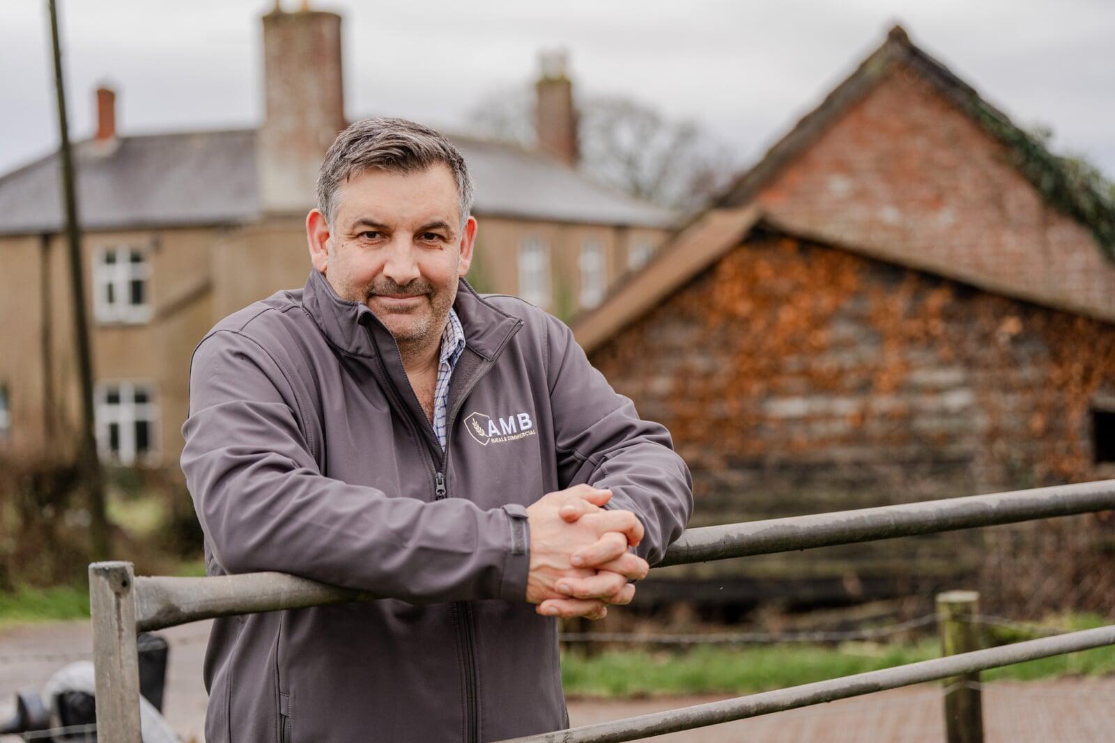 Insurance advisor meeting a farmer on site, highlighting friendly local support and advice.